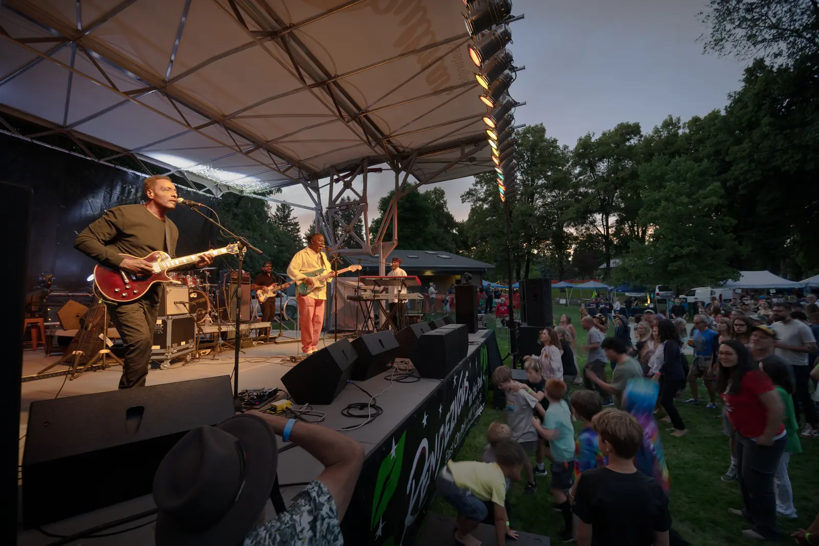 Crowd on the lawn at East City Park during Rendezvous